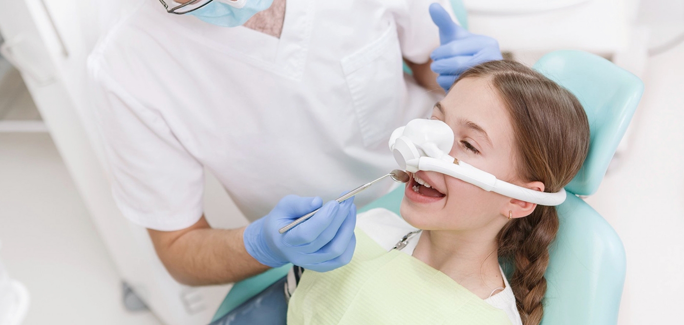 girl getting sedation therapy and dentists