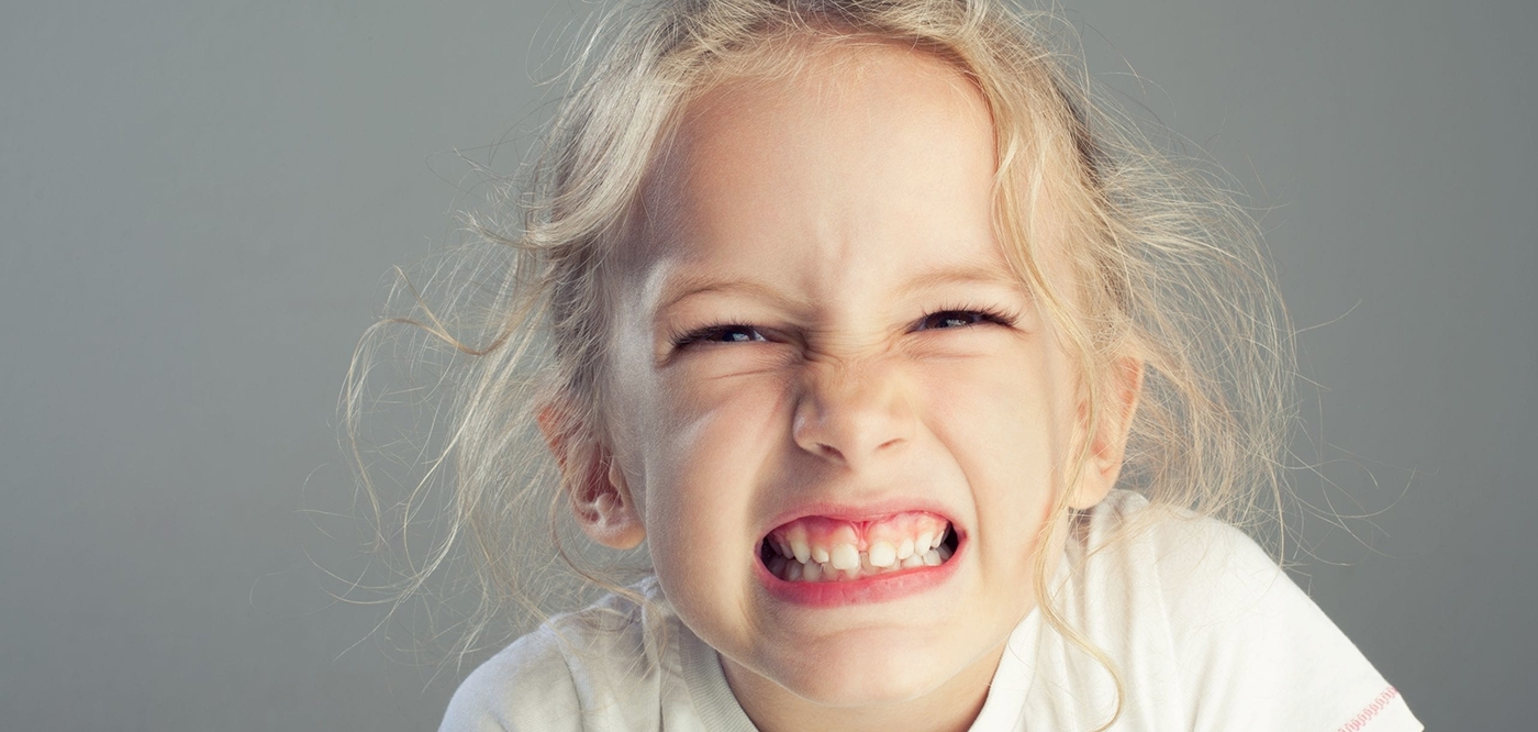 child showing teeth